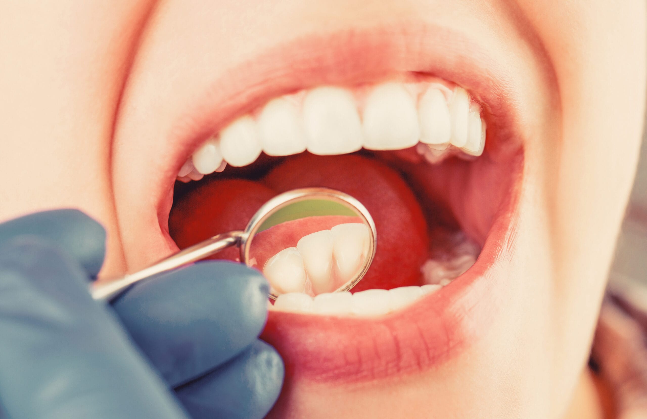 Dental care, taking care of teeth. Girl having teeth examined at dentists. Woman in stomatology clinic with dentist. Healthy teeth concept. Taking care of teeth. Woman at the dentist General Dentistry Sarnia
