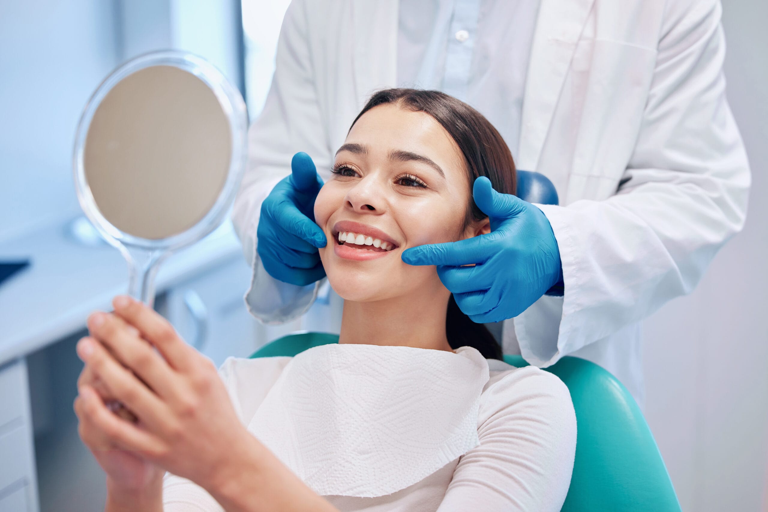 Dentist, mirror and woman check smile after teeth cleaning, braces and dental consultation. Healthcare, dentistry and happy female patient with orthodontist for oral hygiene, wellness and cleaning Emergency Dental Care in Sarnia